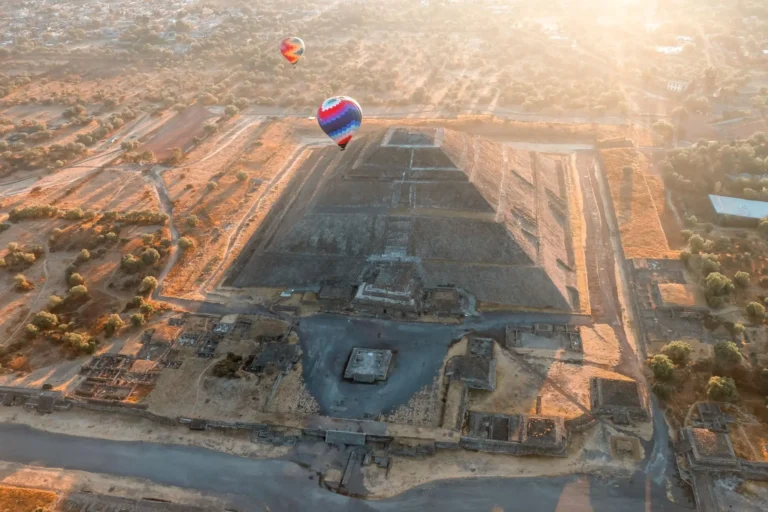 Hot air balloons over the pyramids of Teotihuacan at sunrise